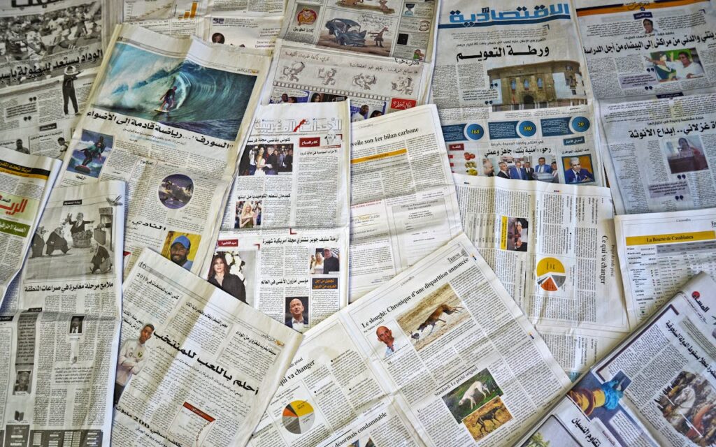 Crafting Captivating Headlines: Your awesome post title goes here A variety of Arabic newspapers laid out, showcasing cultural and news diversity in Fès, Morocco.
